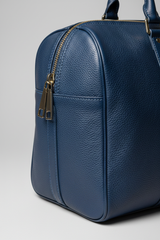 Metropolitan Travel Weekender in Blue, portrait leather and zipper macro close-up