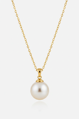 Le Pearl luxury feminine gold pearl pendant necklace centered on white background