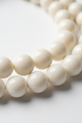 Soft ivory gemstone bead detail of Le Sattva Mala necklace