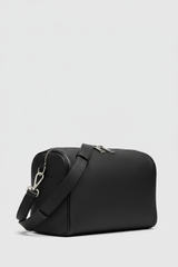 Le Compact Weekender in Black, portrait side-angle shot with strap