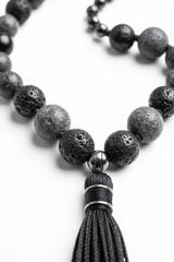 Close-up of natural dark gemstone beads on Stone Mala Necklace in deep grey and black tones