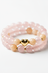 Close-up of soft pastel pink rose quartz and peach aventurine crystal beads on Love Energy Bracelet