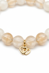 Close-up bead detail of champagne moonstone and cream selenite crystal beads on Heart Soul Bracelet