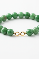 Close-up gemstone detail of smooth jade green beads on Harmony Stone Bracelet
