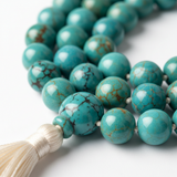 Close-up of premium turquoise gemstone beads on mala necklace