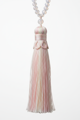 Macro shot of Le Opaline Mala elegant silk tassel in iridescent pastel tones