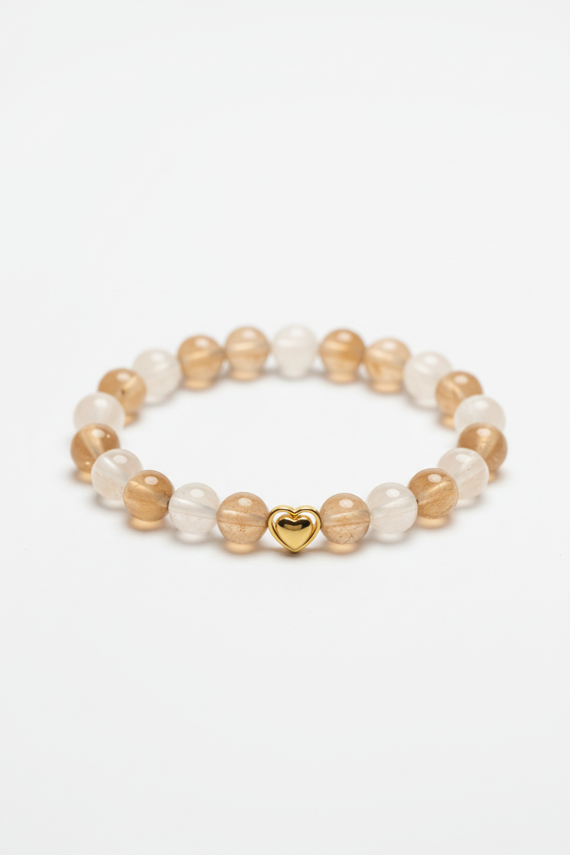 Luxury spiritual bead bracelet with champagne moonstone and cream selenite beads and gold double heart charm, front view