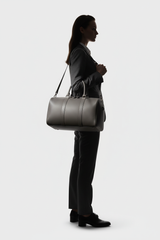 Le Compact Weekender in Gray, portrait lifestyle travel model image