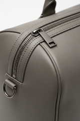 Metropolitan Travel Weekender in Gray, portrait leather and zipper macro close-up