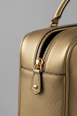 Executive Carry Weekender in Gold Premium Signature Leather – leather and zipper macro close-up