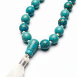 Close-up detail of handcrafted turquoise gemstone beads