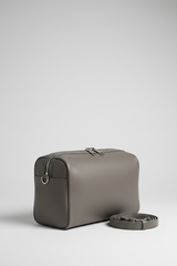 Le Compact Weekender in Gray, portrait side-angle shot with strap