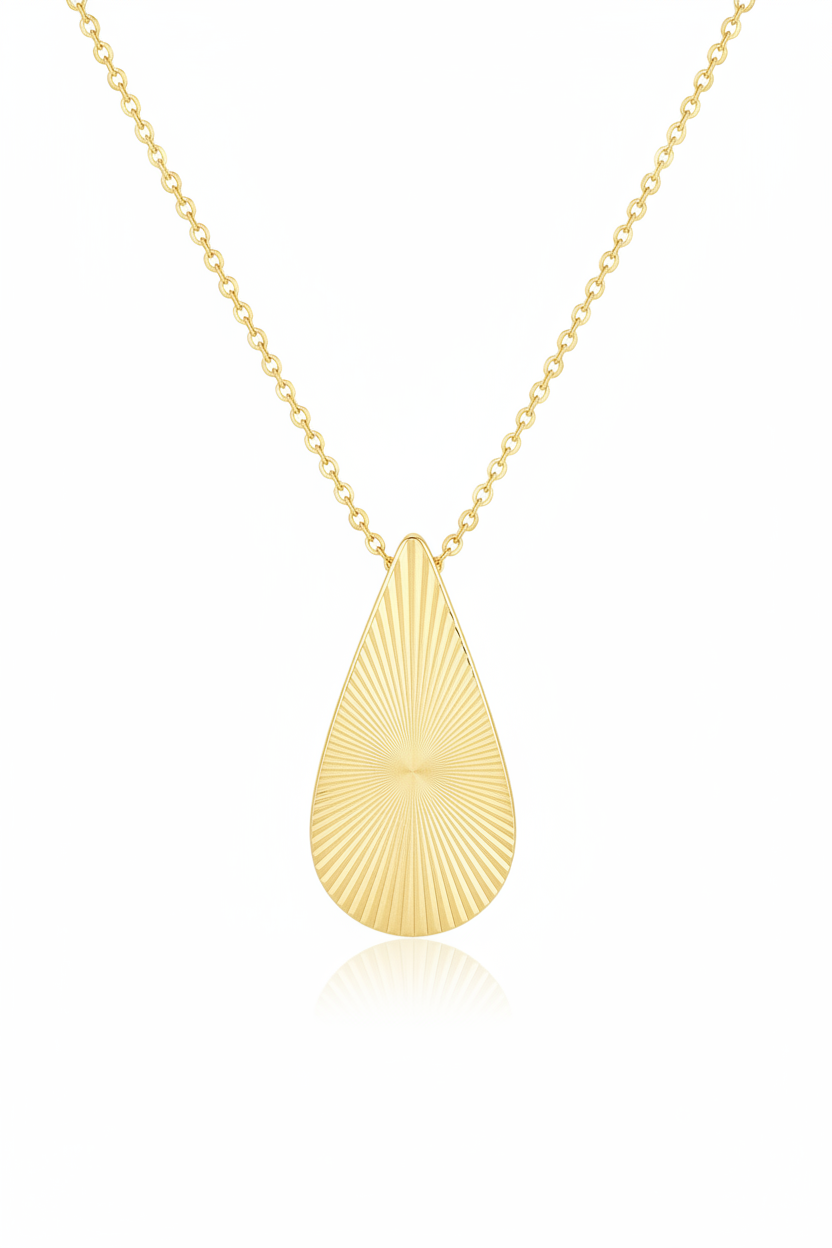 Luxury gold teardrop pendant necklace with sunray engraving, centered on white background