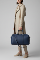 Metropolitan Travel Weekender in Blue, portrait travel lifestyle model image