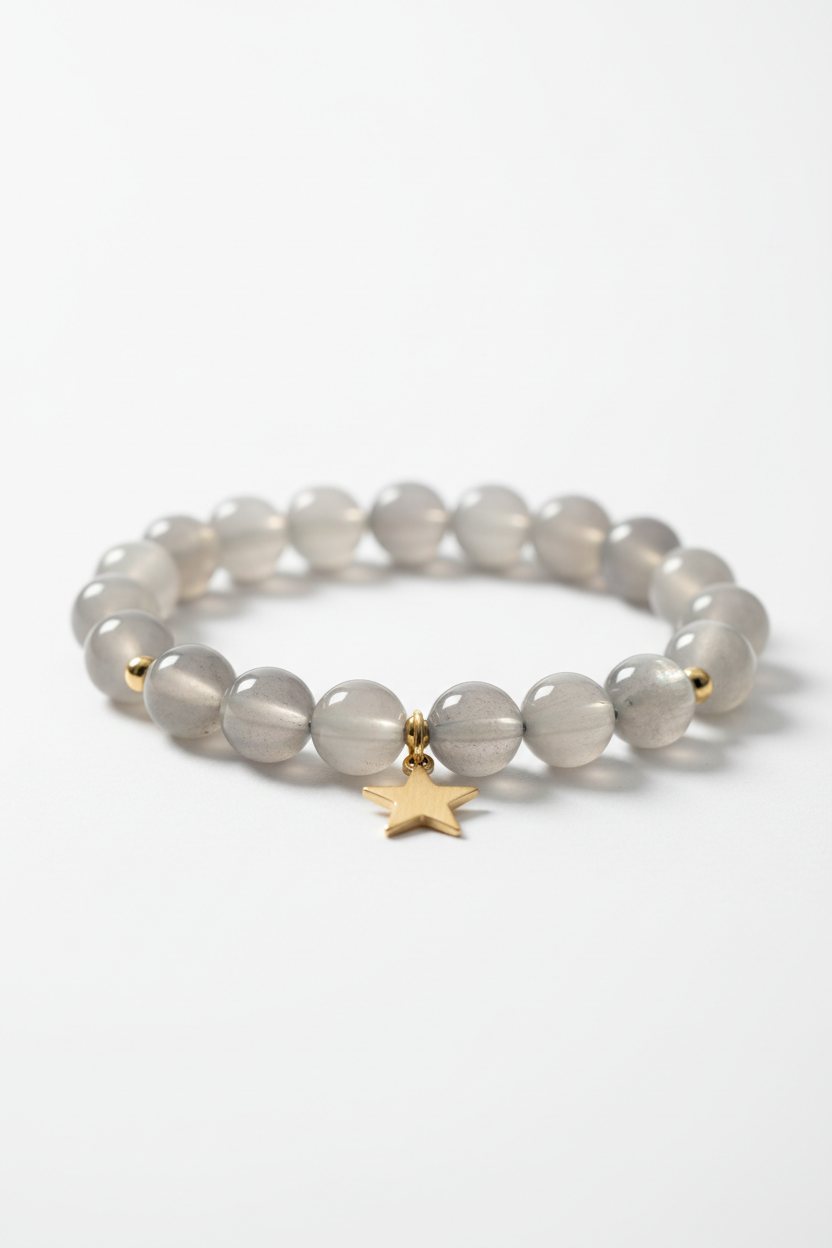 Luxury feminine moonstone bead bracelet with gold star charm, side angle view