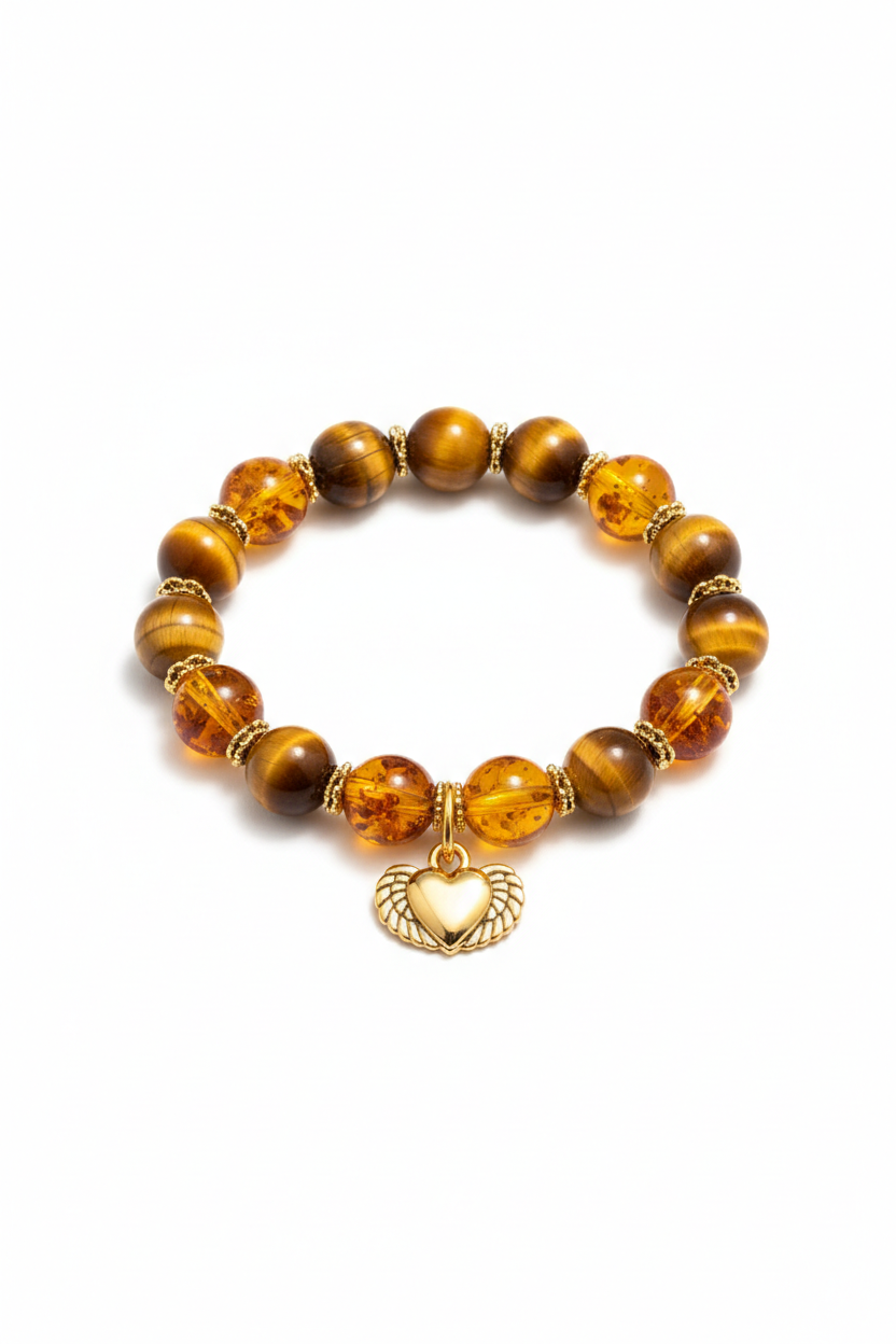 Luxury feminine spiritual bracelet with golden tiger's eye and honey amber beads and gold winged heart charm, front view