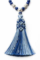 Close-up of Le Celeste Mala elegant silk tassel in celestial tones