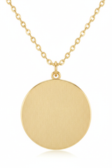 Jewelry macro close-up of Golden Aura Necklace showing hammered gold disc texture and chain detail