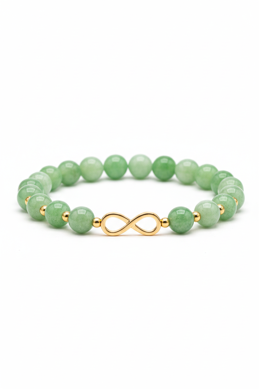 Luxury jade green gemstone bracelet with gold infinity charm, side angle view