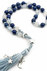 Macro detail of Le Celeste Mala gemstone bead texture and cord craftsmanship