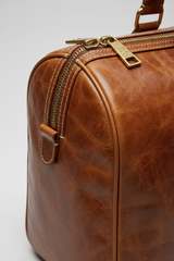 Metropolitan Travel Weekender in Bronze, portrait leather and zipper macro close-up