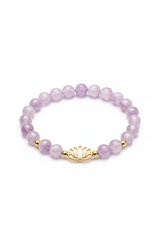 Luxury spiritual bracelet with lavender amethyst beads and gold lotus charm on white background