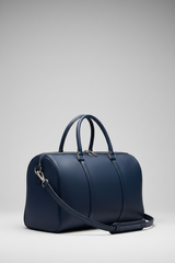 Metropolitan Travel Weekender in Blue, portrait side-angle shot with strap