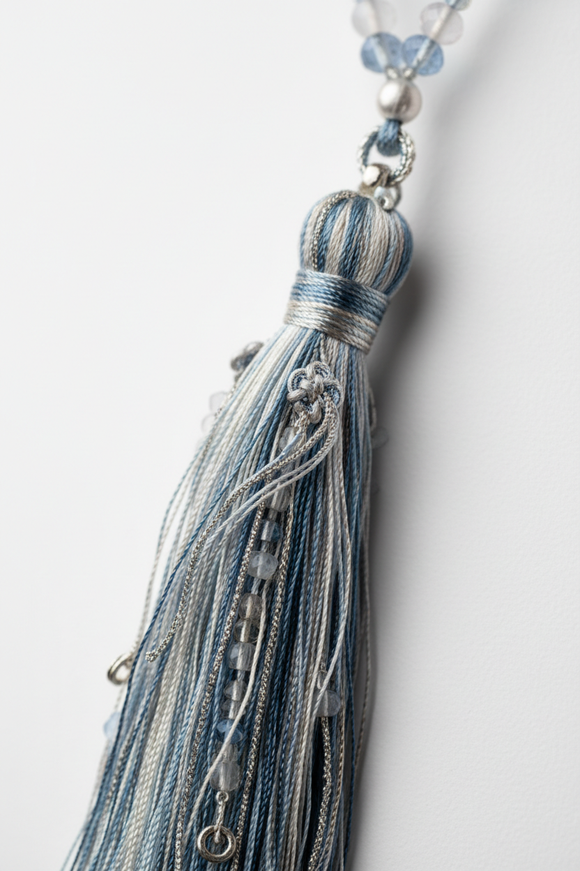 Close-up of Le Luna Mala elegant silk tassel in moonstone tones