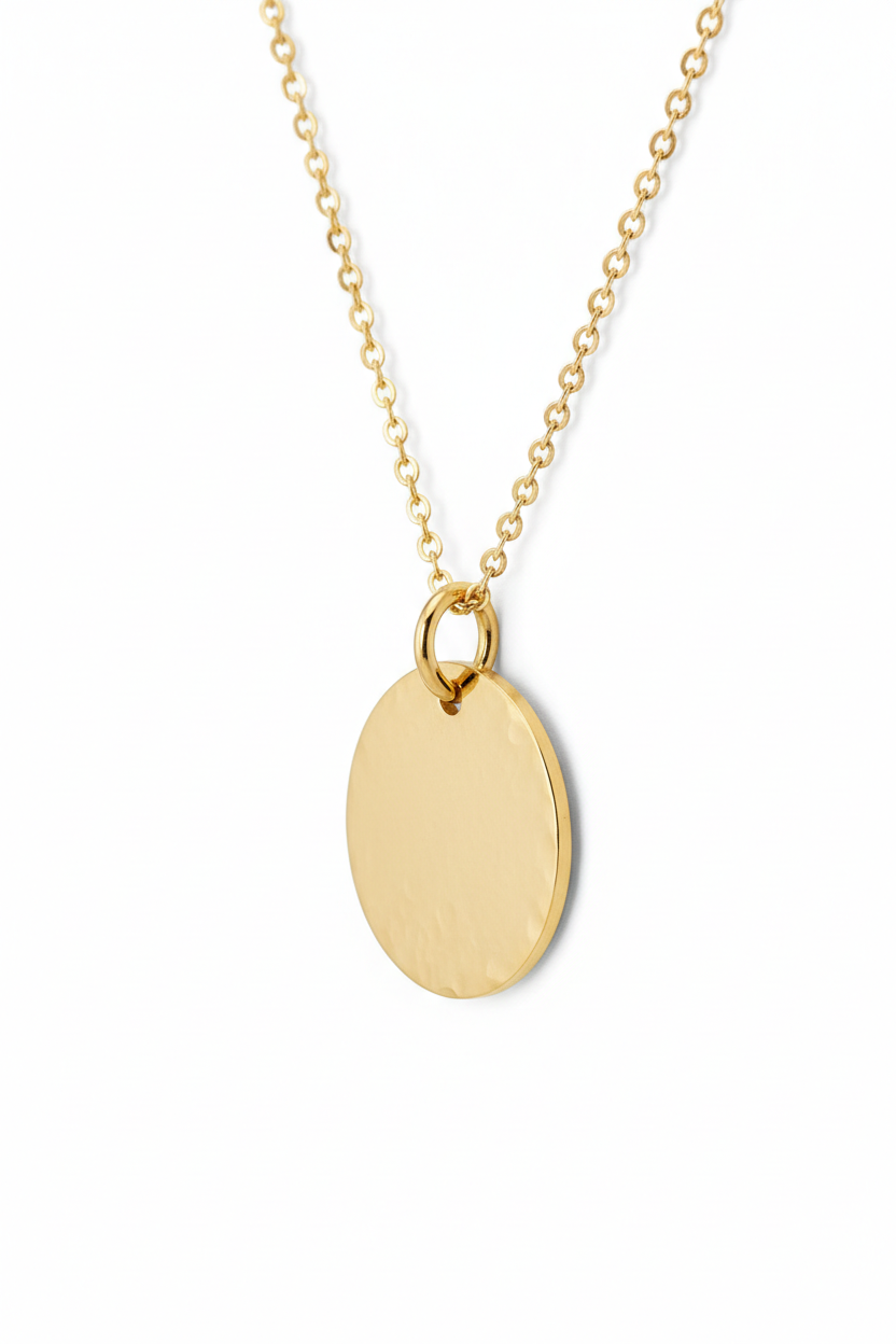 Luxury spiritual gold disc pendant necklace with hammered texture, side angle view