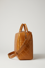 Executive Carry Weekender in Gold Premium Signature Leather – side angle with strap