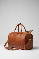 Le Compact Weekender in Brown, portrait side-angle shot with strap