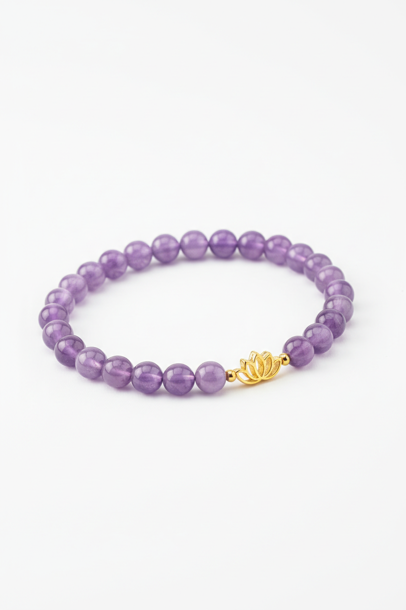 Luxury spiritual bracelet with lavender amethyst beads and gold lotus charm, angle view