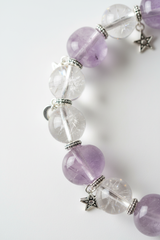 Macro close-up of natural crystal gemstone beads on Pure Energy Bracelet with light refractions