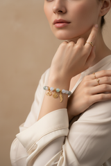 Elegant female model wearing Inner Peace Bracelet natural gemstone bead bracelet on wrist