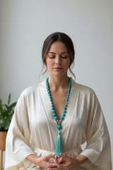 Woman wearing luxury turquoise mala necklace