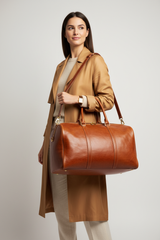 Metropolitan Travel Weekender in Bronze, portrait travel lifestyle model image