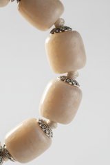 Close-up of premium gemstone beads on Calm Soul Bracelet in soft neutral cream and ivory tones